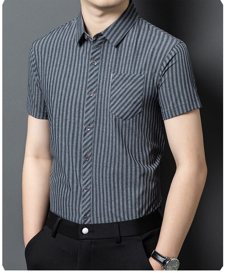 Angled view of Jiskavi charcoal grey striped short sleeve shirt with black trousers