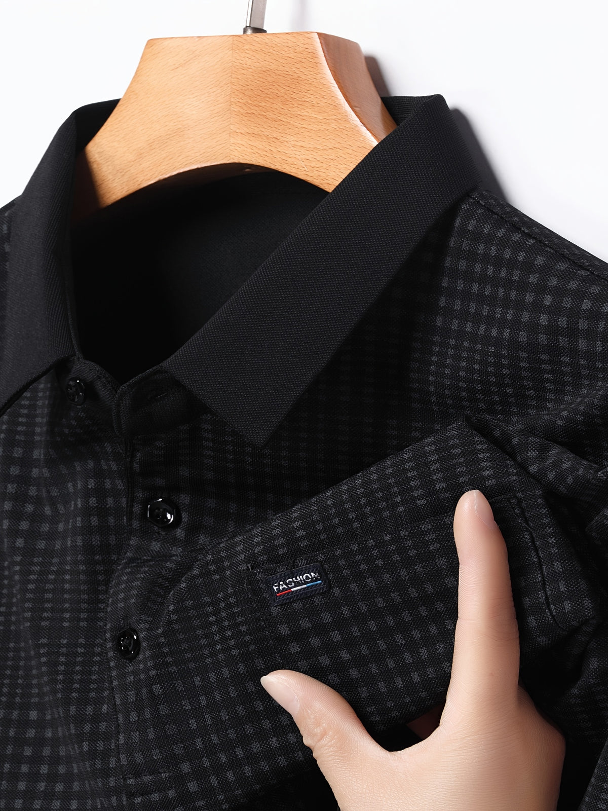 Close-up of Jiskavi jet black micro check polo collar buttons and fabric pattern