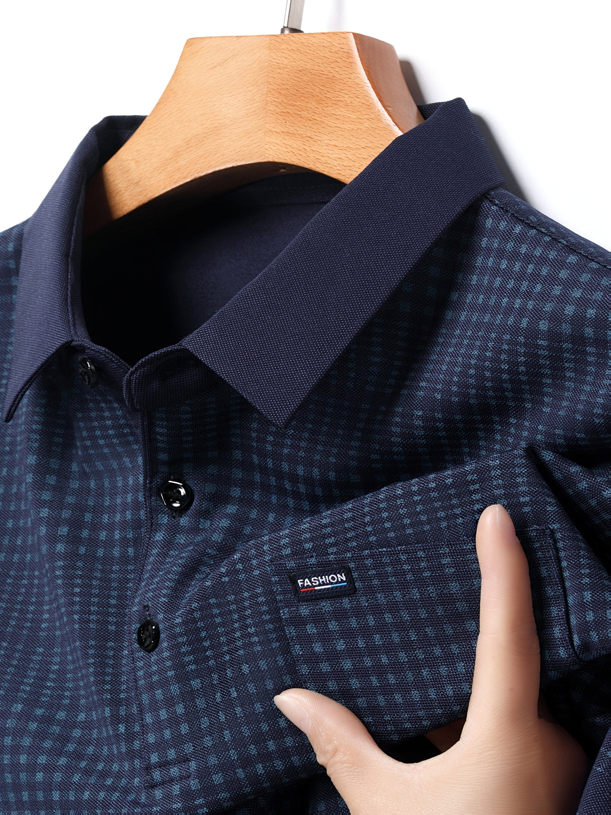 Close-up of Jiskavi midnight navy micro check polo fabric collar and buttons