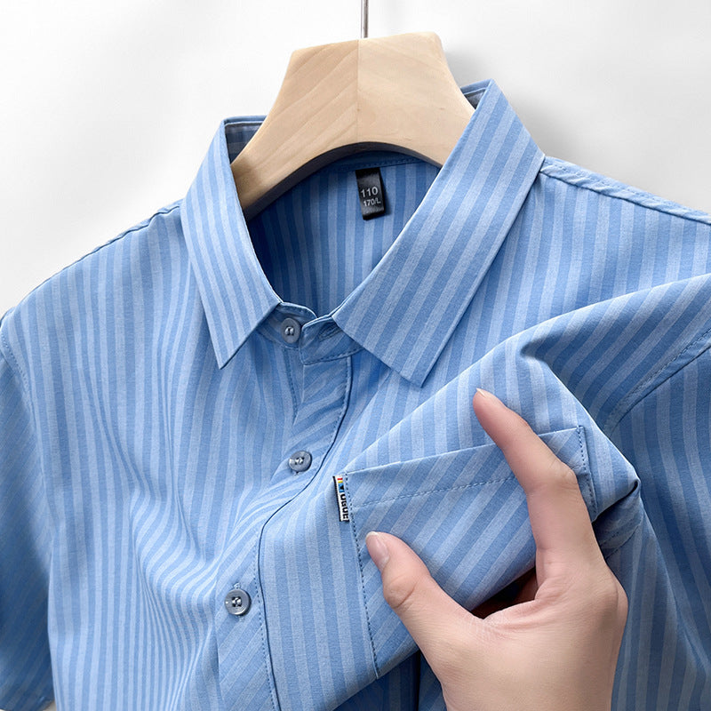 Close-up showing sky blue pinstripe shirt collar chest pocket and linen-feel fabric