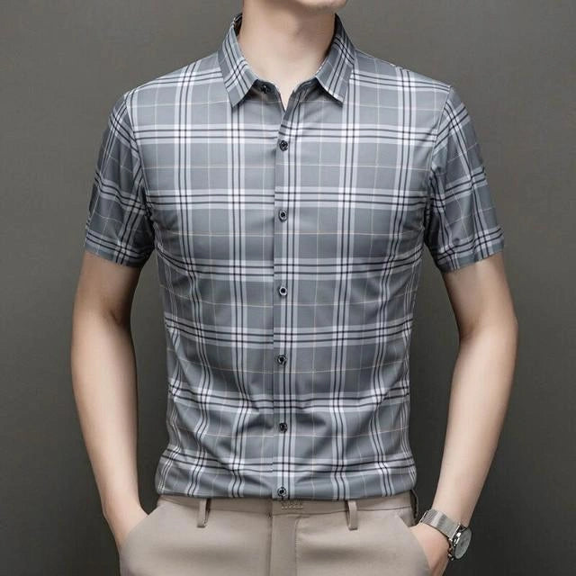 Jiskavi slate grey heritage plaid slim fit half sleeve shirt — front view on model with beige chinos