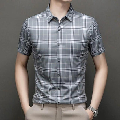 Jiskavi slate grey heritage plaid slim fit half sleeve shirt — front view on model with beige chinos